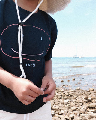 WEARING A FLAT SMILE SUPIMA® T-SHIRT