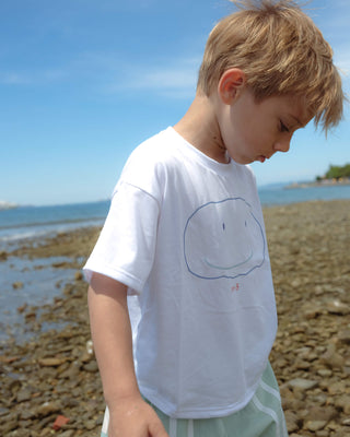 WEARING A FLAT SMILE SUPIMA® T-SHIRT